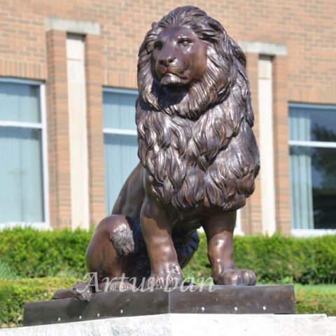 lion statues in front of house