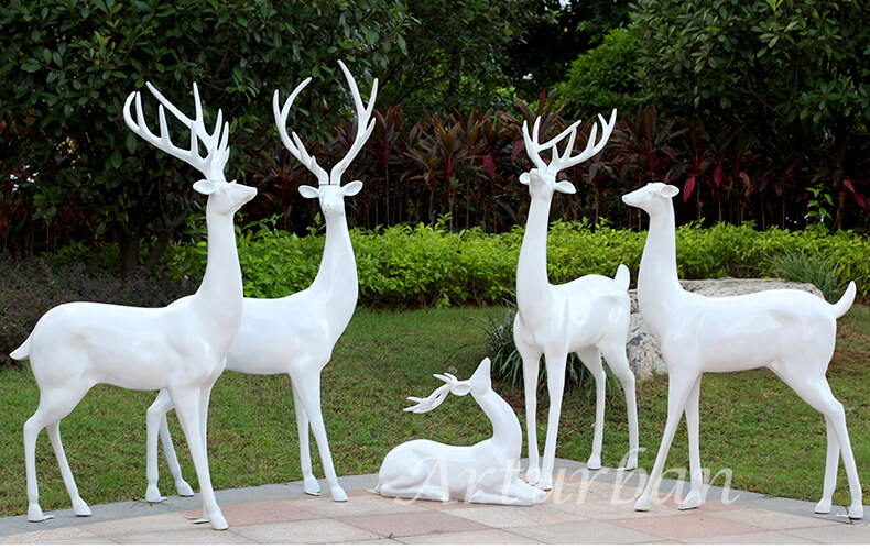 family white deer statues