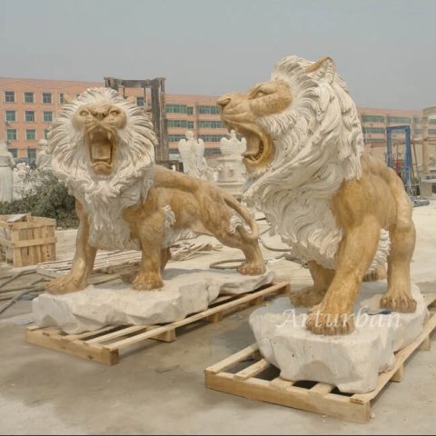 lion statue in front of homes