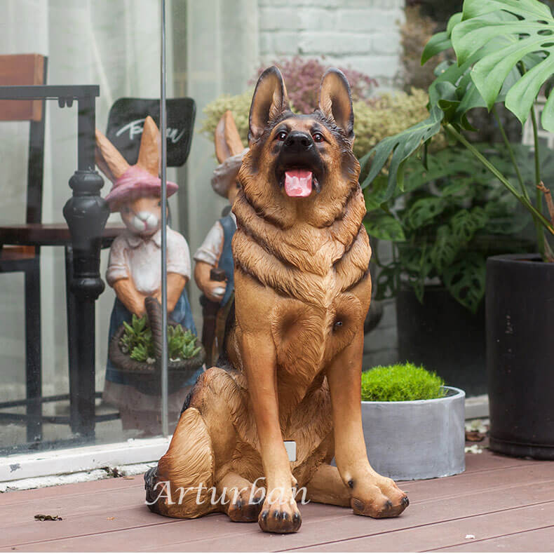 front of german shepherd statue