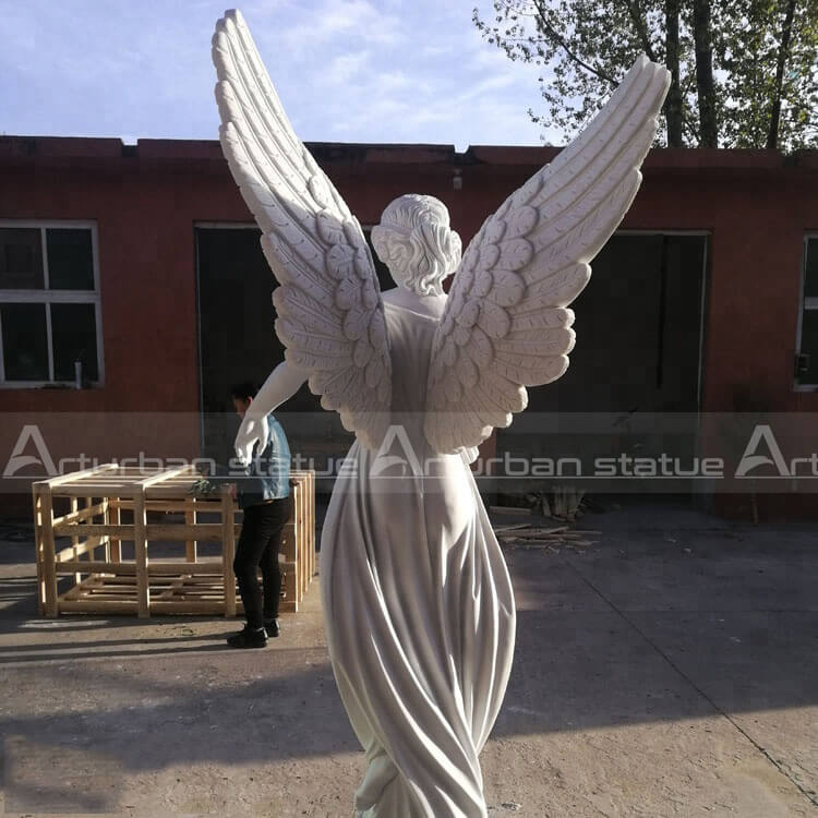 the back of angel outdoor garden statue