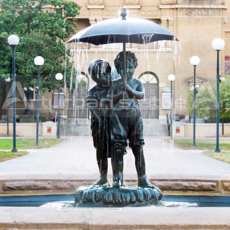 boy and girl water fountain with umbrella