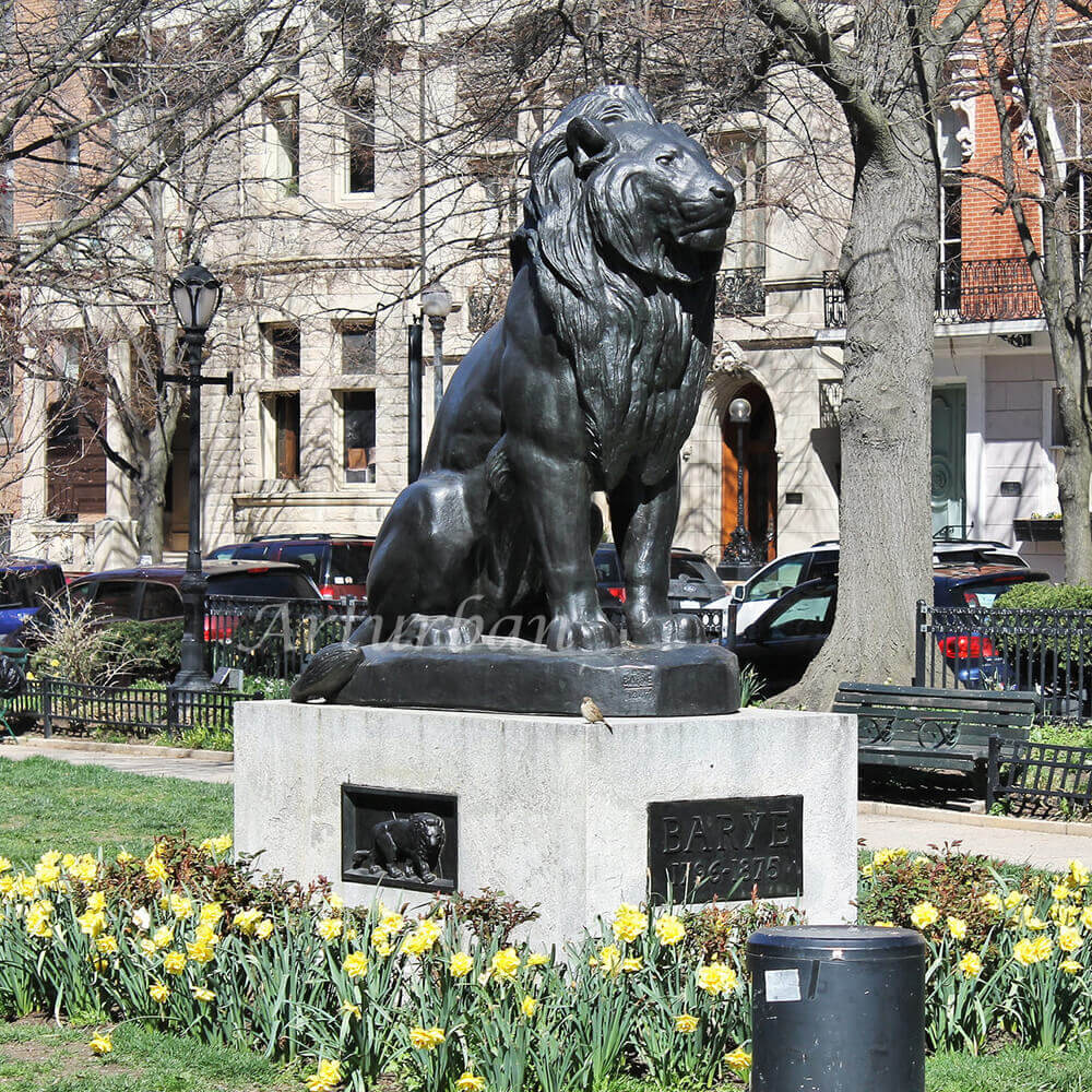 Sitting lion statue in front of house