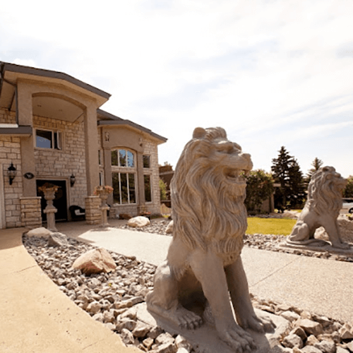 lion statue in front of house