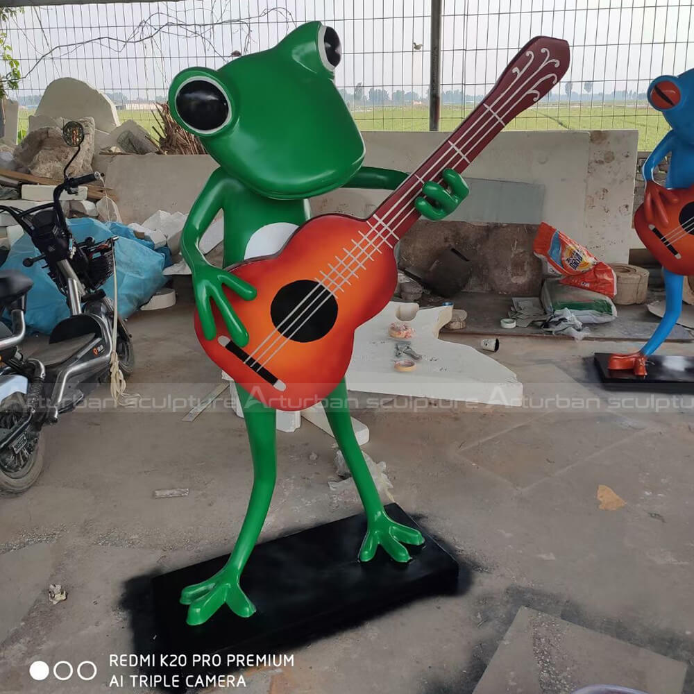 frog playing guitar garden statue