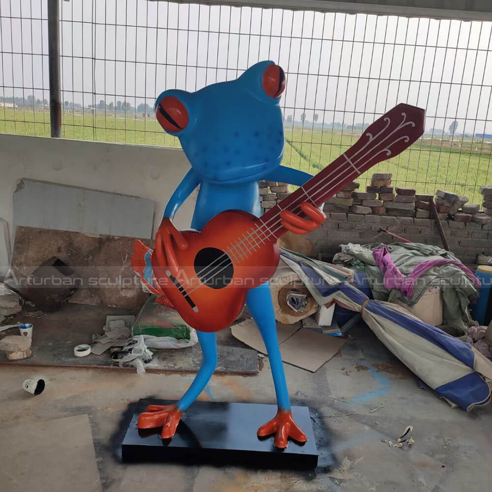 fiberglass frog playing guitar garden statue