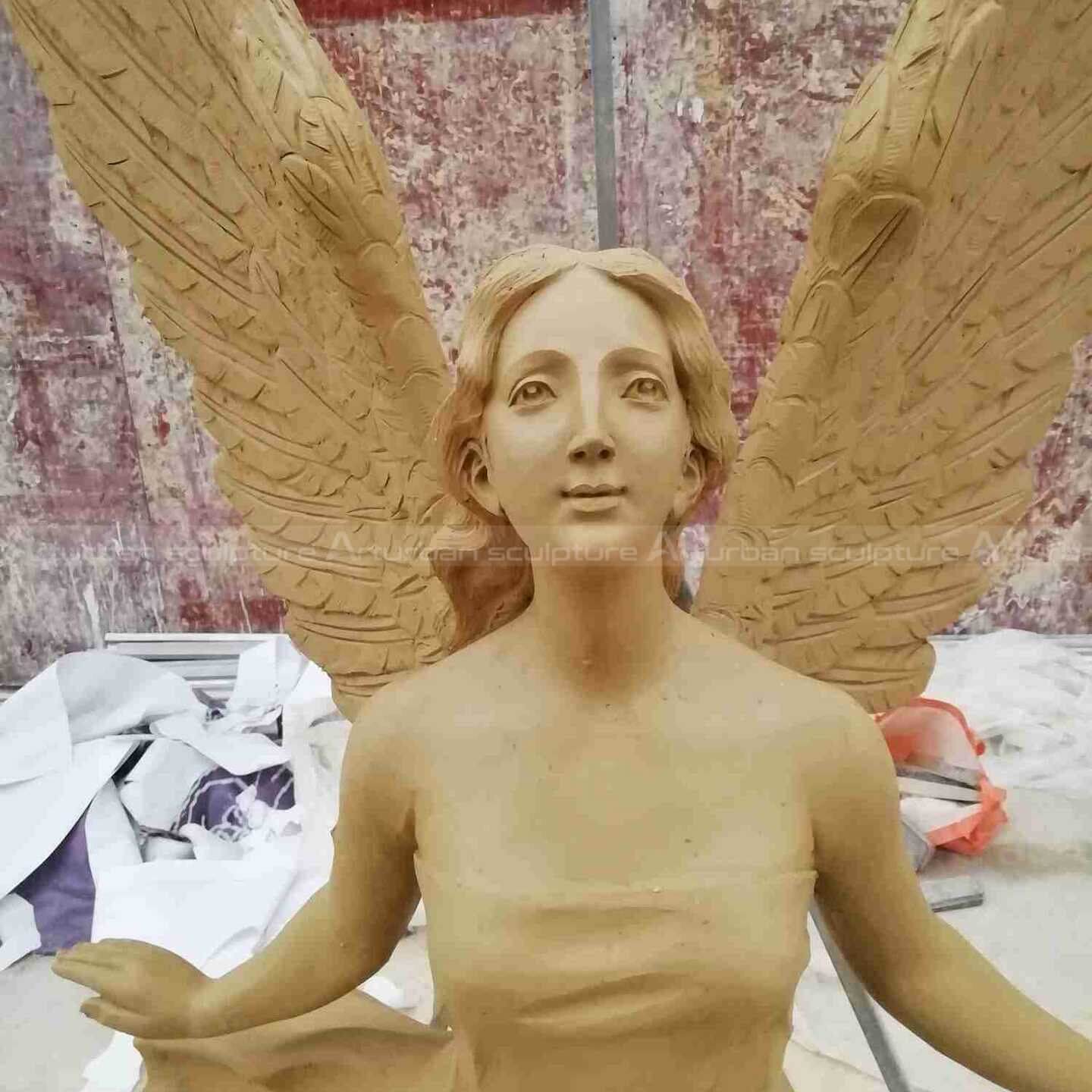 flying female angel statue