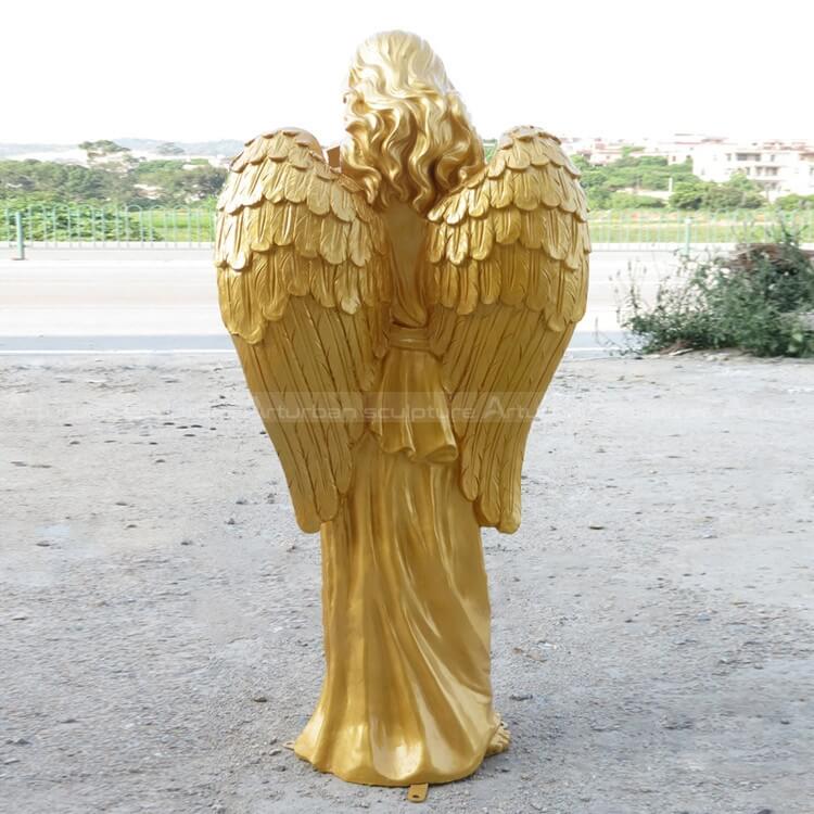 back side of golden angel sculpure