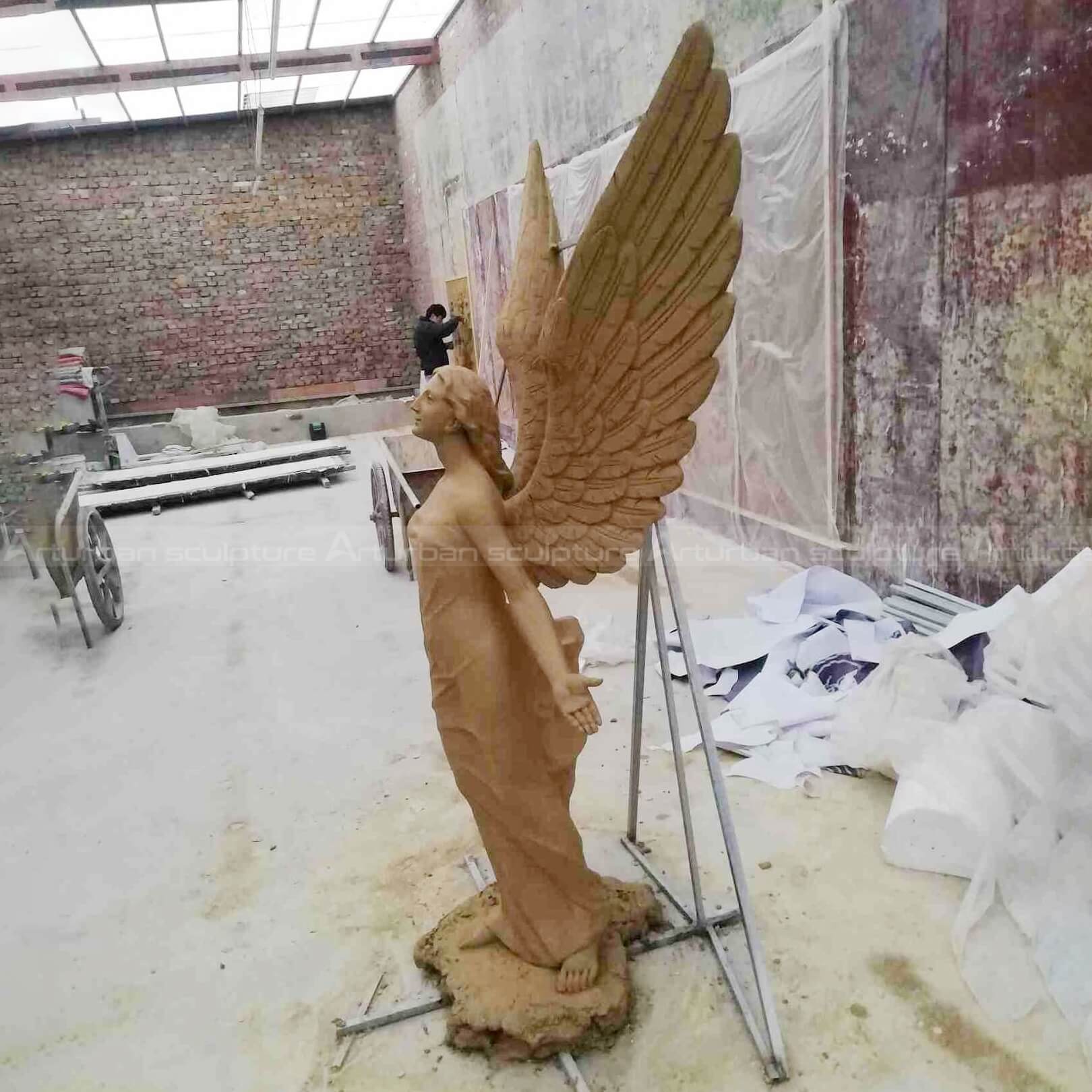 large flying angel sculpture