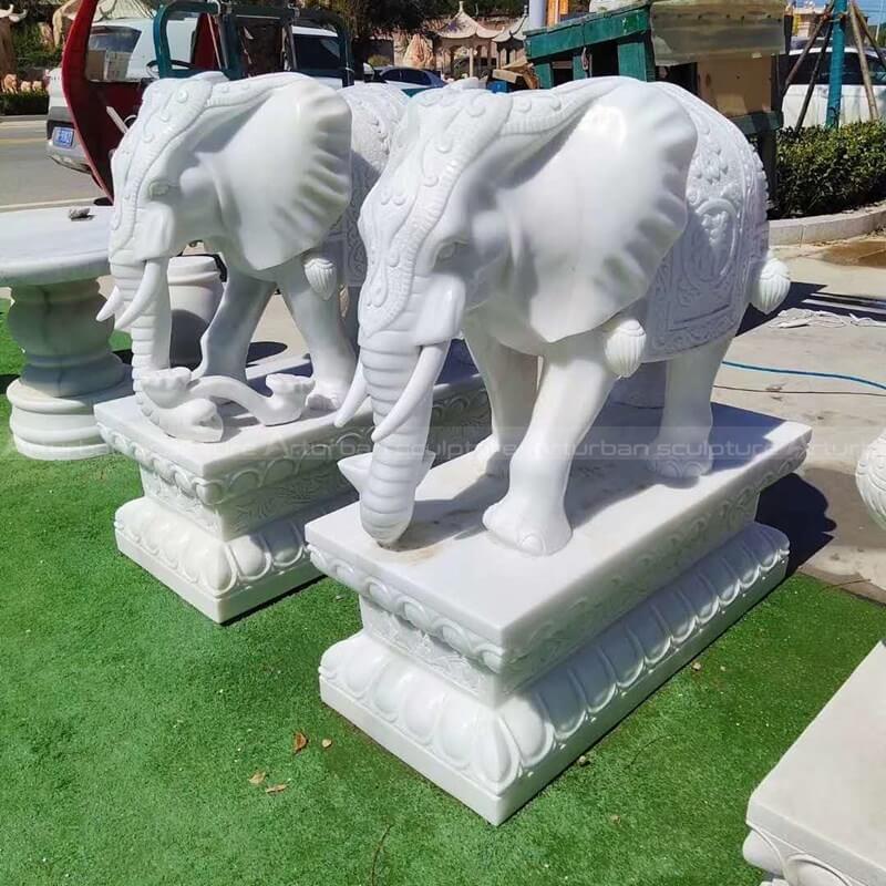 white marble elephant sculpture in pair