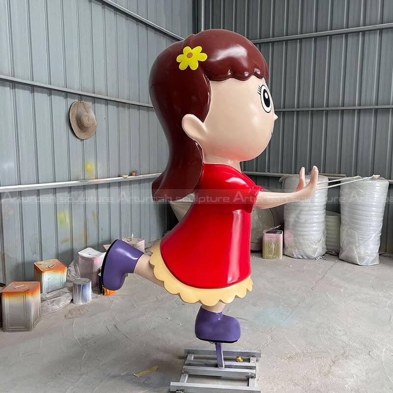 girl cartoon sculpture