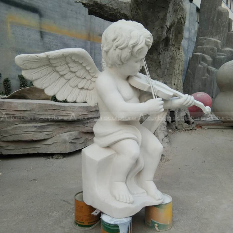 cherub sculpture playing violin