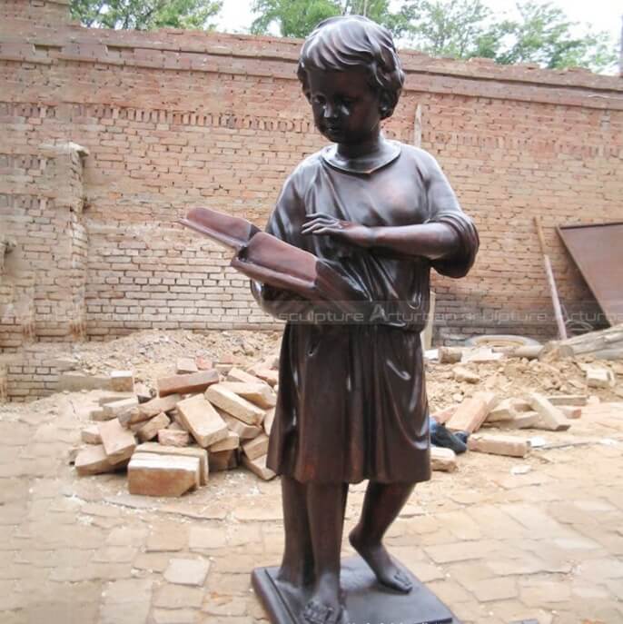 boy reading book statue