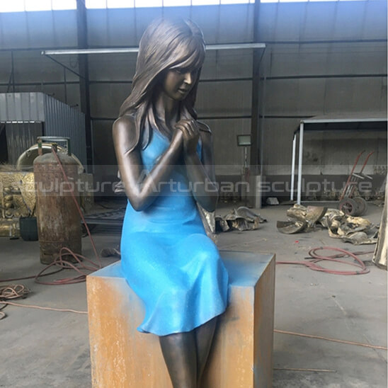 girl sitting statues