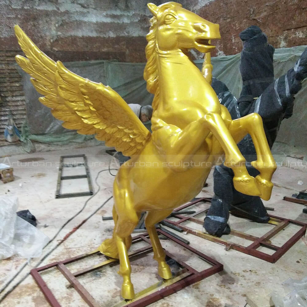 gold winged horse statue