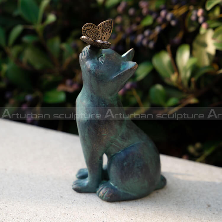cat statue with butterfly