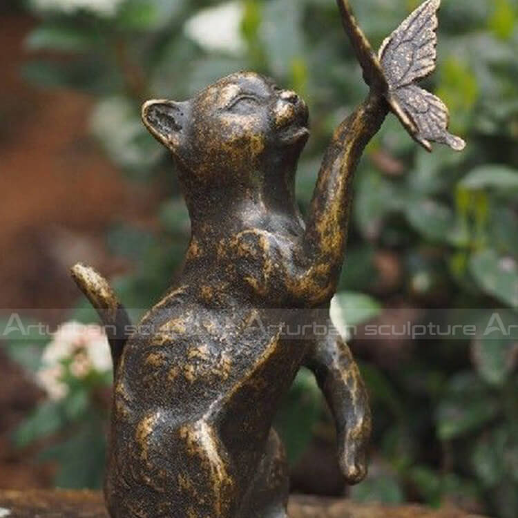cat and butterfly sculpture