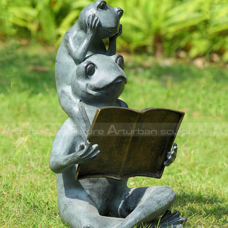 reading frog statue