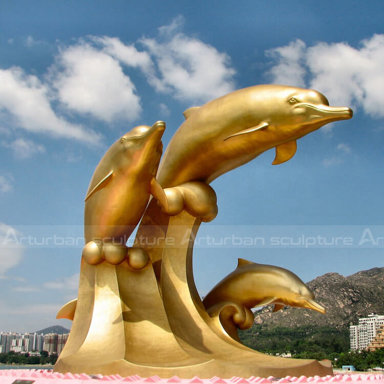 gold dolphin statue