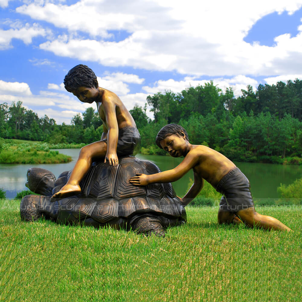 boy on turtle sculpture