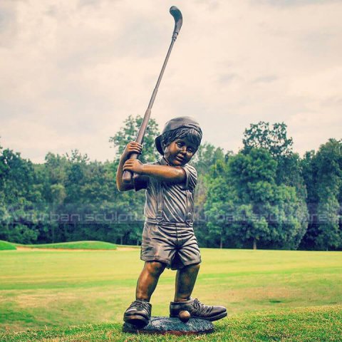little boy golfer statue