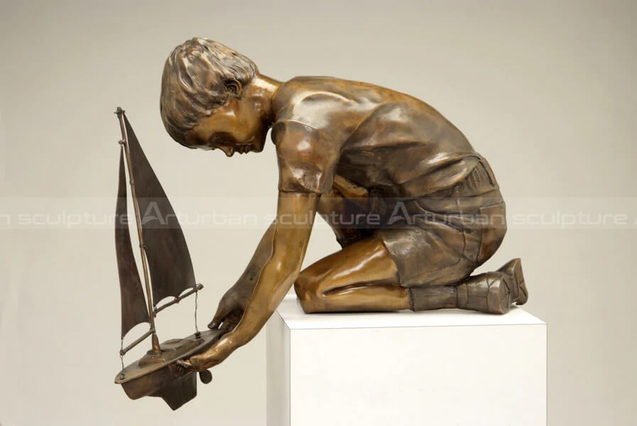 boyand his boat sculpture