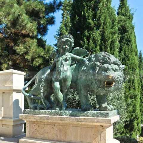 lion and cherub statue