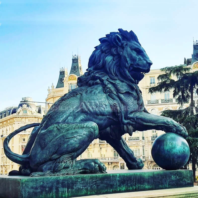lion holding ball statue