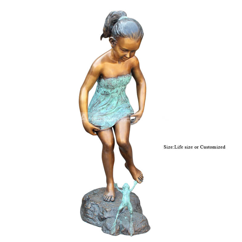 girl with frog sculpture