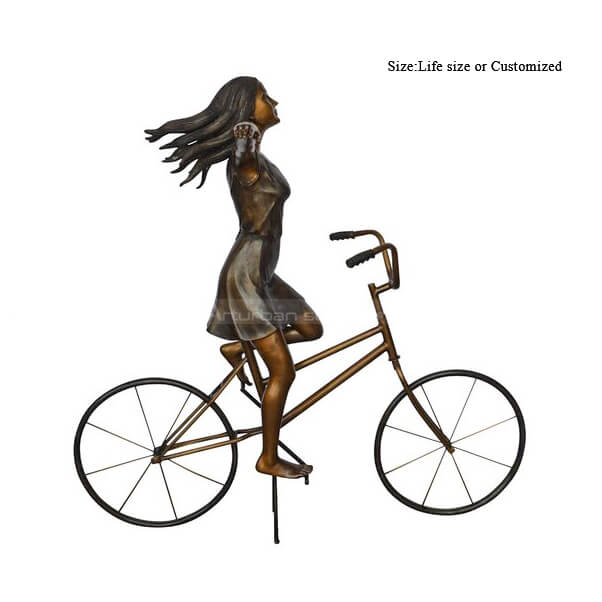 girl on bicycle statue