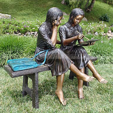 two students on bench statue