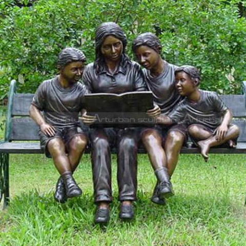 mother and child reading sculpture