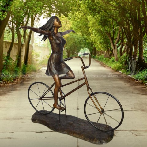 girl on bicycle statue