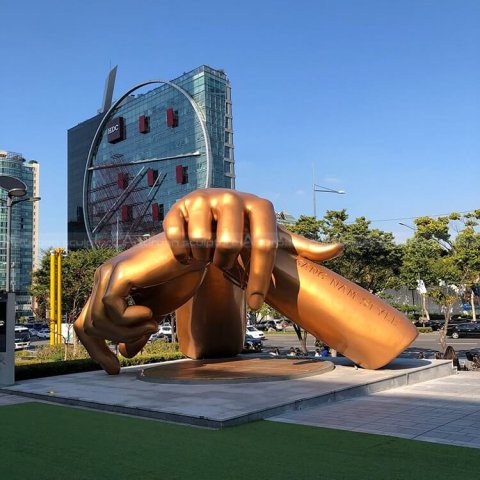 brass hand sculpture