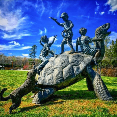 Children on Turtle Sculpture