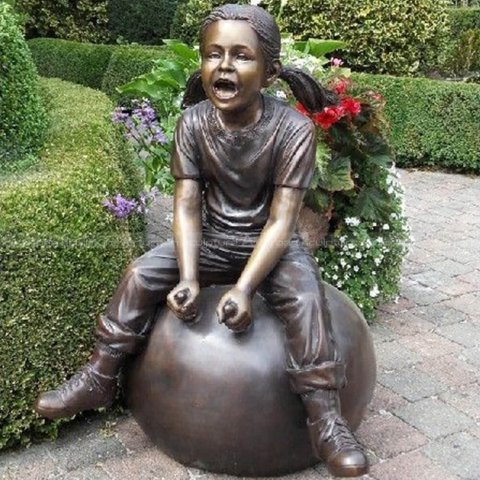 girl playing garden sculpture