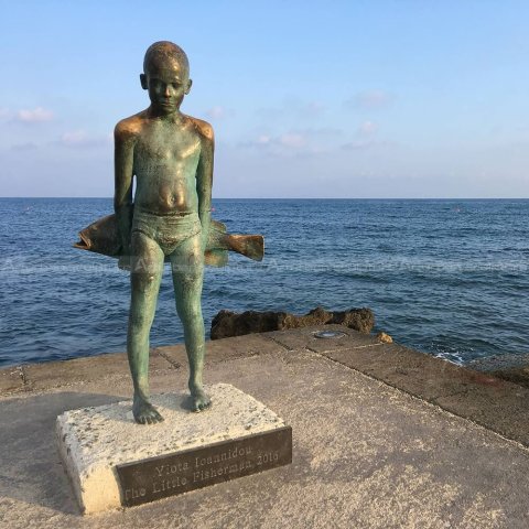 little fisherman statue