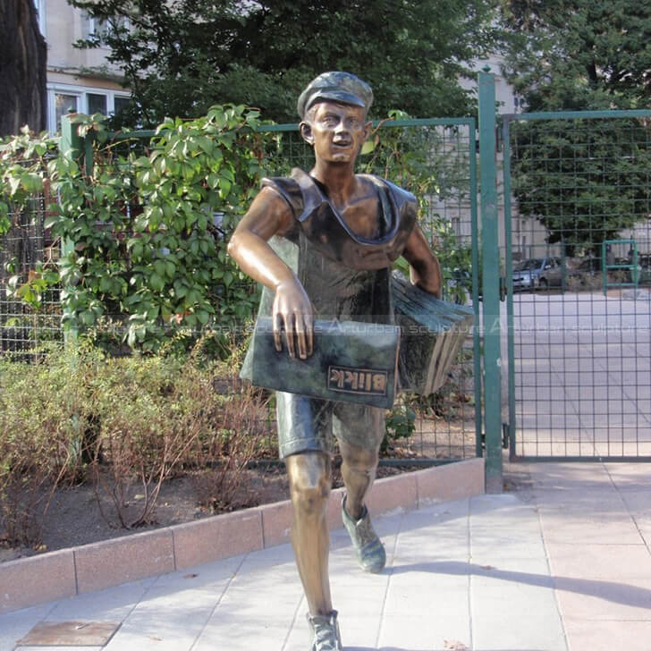 Newspaper boy statue