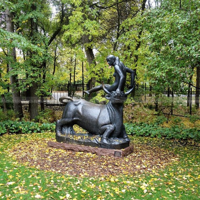 Woman Riding Bull Statue