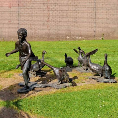 boy and geese sculpture