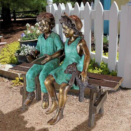 Boy and Girl on Bench Sculpture