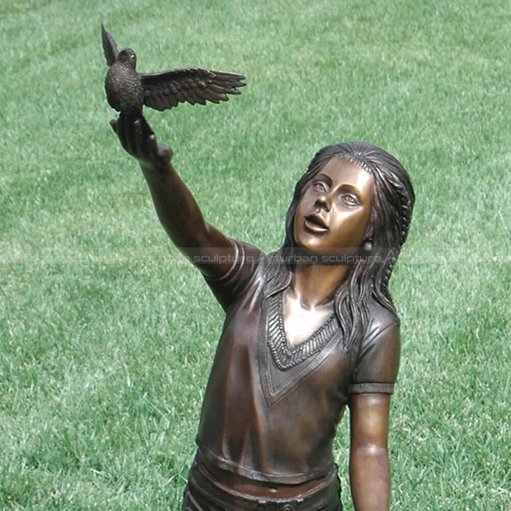 girl with bird sculpture