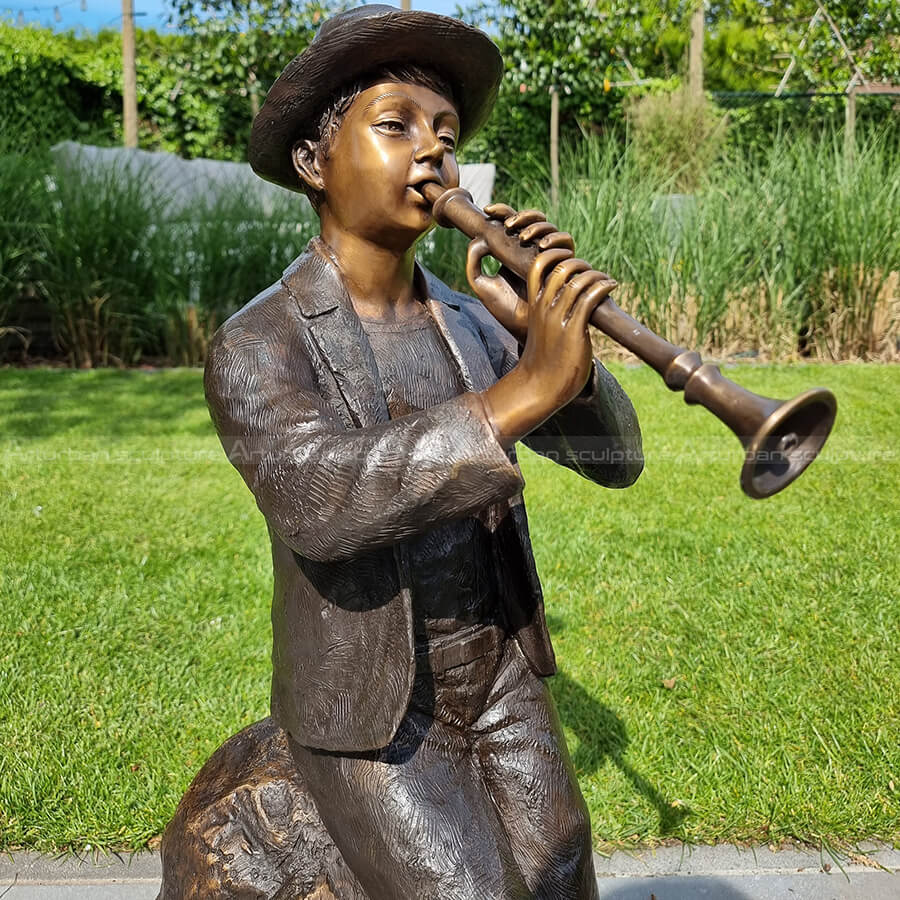 boy with flute statue