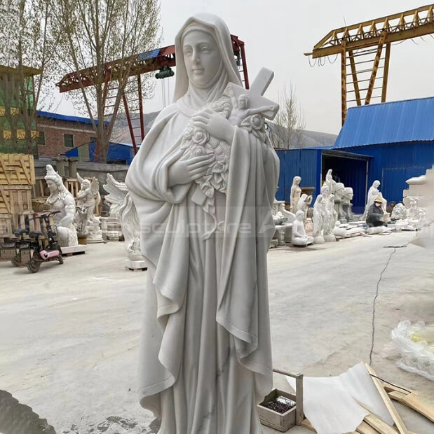 virgin mary holding jesus sculpture