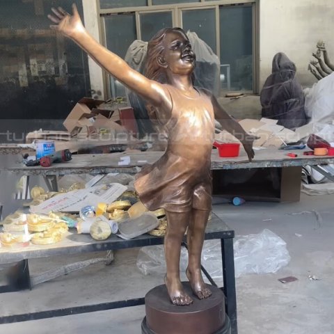 happy girl statue